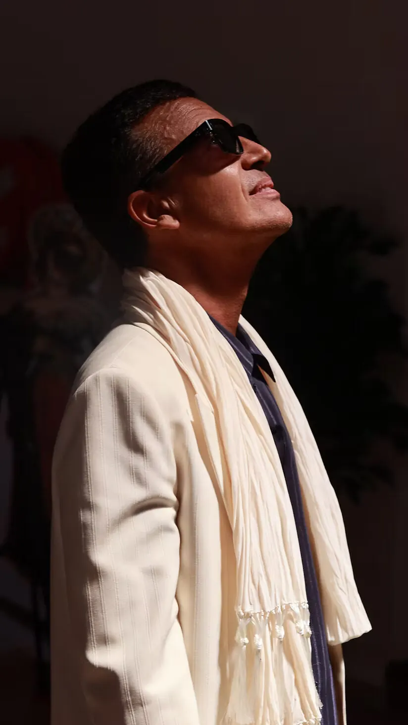 Omar Harfouch — serene portrait, looking toward the light